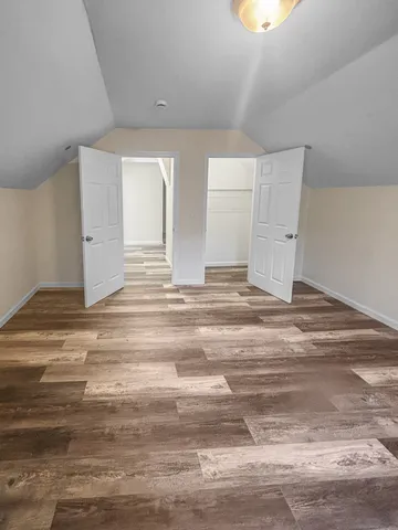 a view of a livingroom with wooden floor