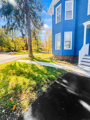 a view of a house with a yard