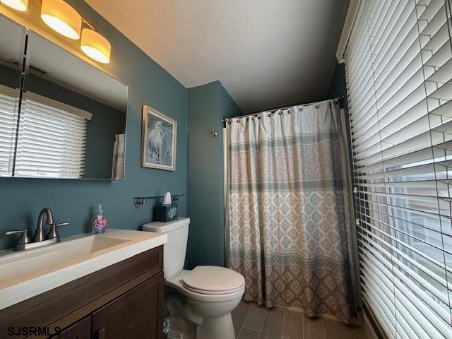 1328 Ouimet Road Brigantine, NJ 08203 - Photo 14 of 33 a bathroom with a sink toilet and window