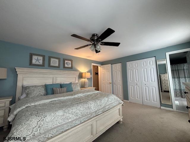 1328 Ouimet Road Brigantine, NJ 08203 - Photo 15 of 33 a bedroom with a large bed and a ceiling fan