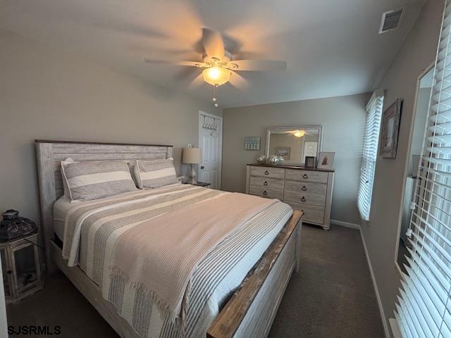 1328 Ouimet Road Brigantine, NJ 08203 - Photo 18 of 33 a bedroom with a bed and a chandelier