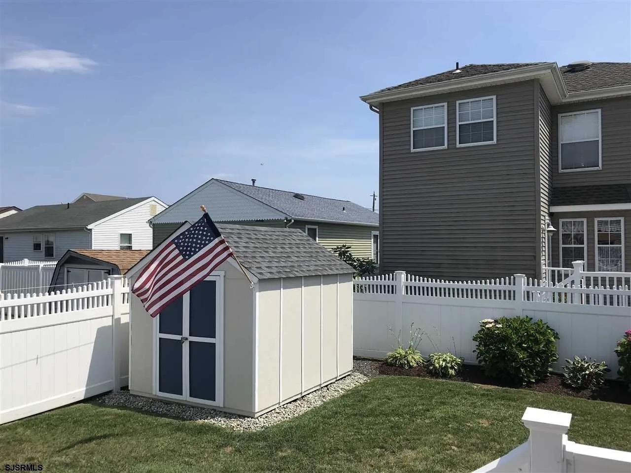 1328 Ouimet Road Brigantine, NJ 08203 - Photo 33 of 33 a view of front of house with a yard