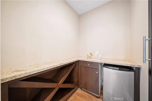 a large kitchen with a table and chairs