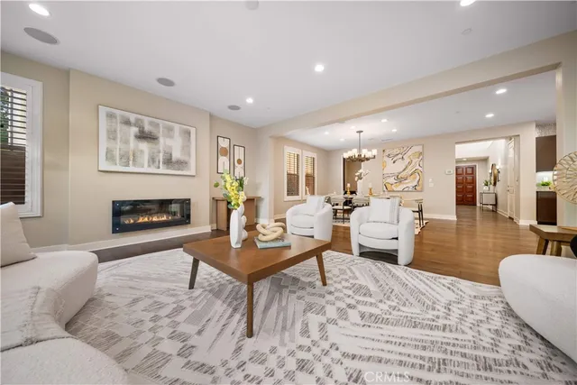 a kitchen with granite countertop a sink a stove and a wooden cabinets