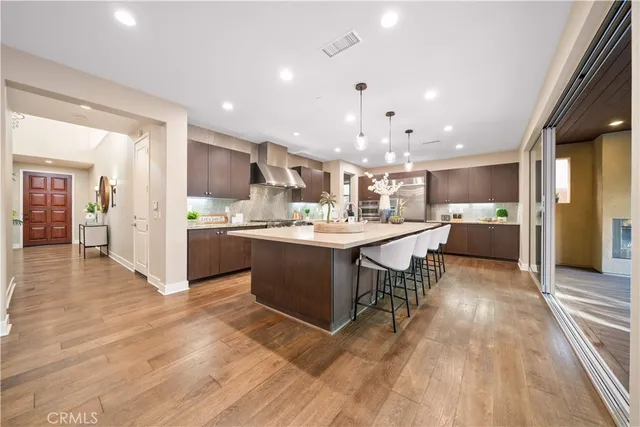 a view of staircase with lots of frames and couches