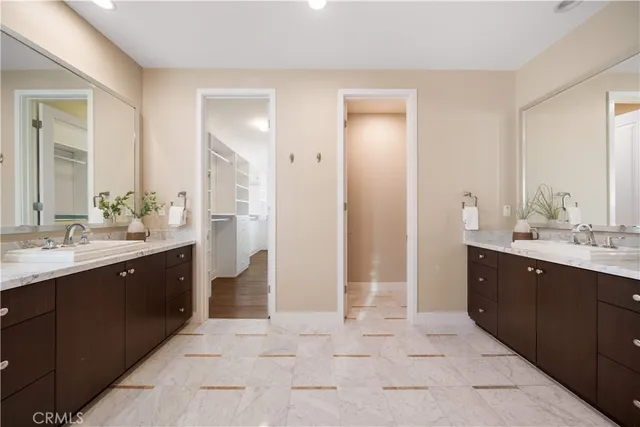 a white toilet sitting next to a bath tub