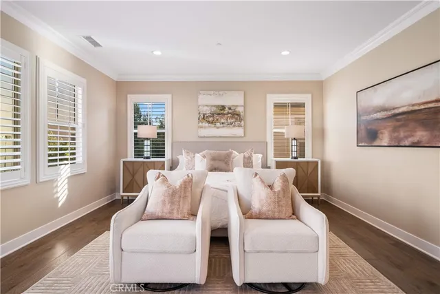 a lobby with furniture and floor to ceiling window