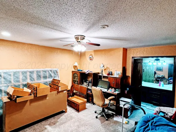 a living room with furniture pool and a large window