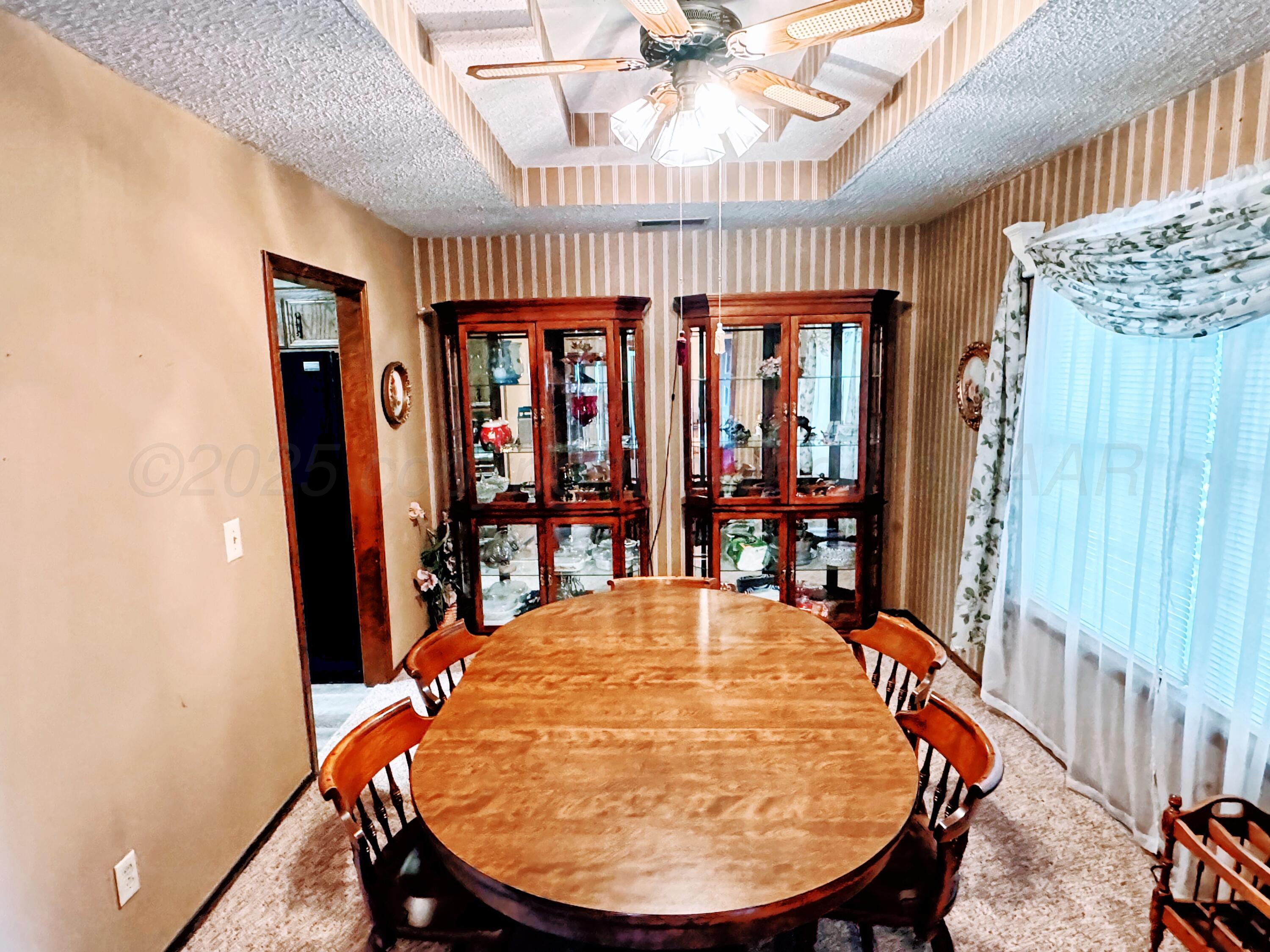 2310 South Elm Street Perryton, TX 79070 - Photo 2 of 24 an outdoor dining space with furniture