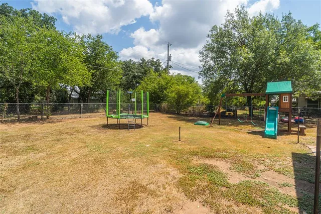 a swimming pool with trees in the background