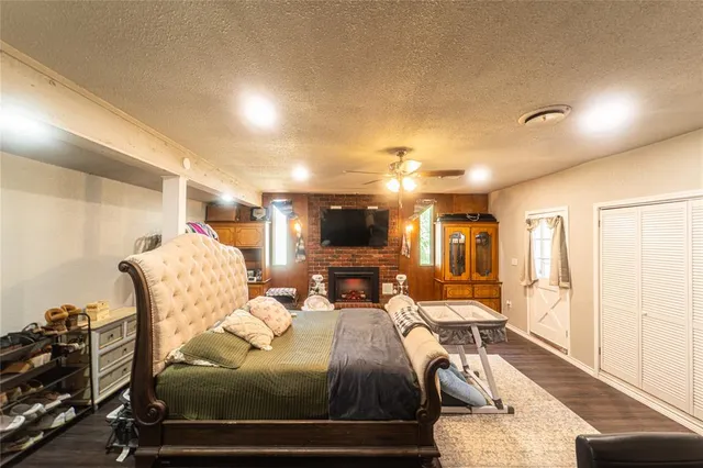 a bedroom with furniture and flat screen tv