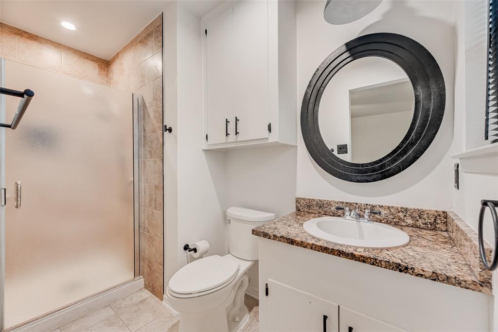 1017 Calcutta Street Hurst, TX 76053 - Photo 11 of 18 a bathroom with a granite countertop sink and a mirror