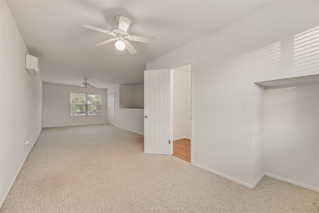 1017 Calcutta Street Hurst, TX 76053 - Photo 15 of 18 a view of an empty room with a ceiling fan and window