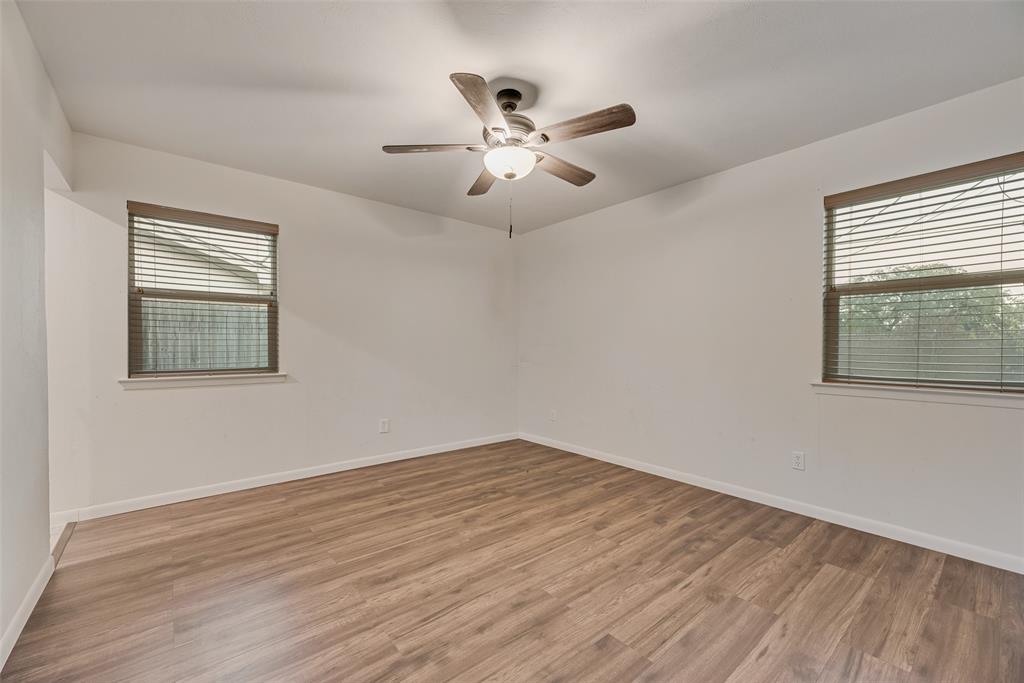 1017 Calcutta Street Hurst, TX 76053 - Photo 9 of 18 a view of empty room with wooden floor and fan