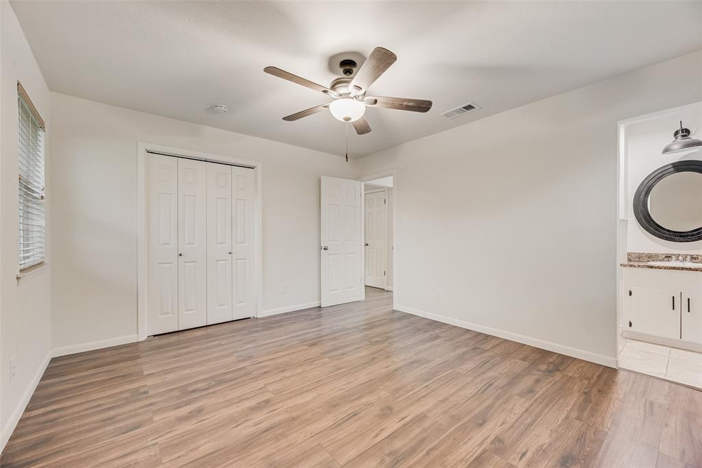 1017 Calcutta Street Hurst, TX 76053 - Photo 10 of 18 a view of an empty room with wooden floor