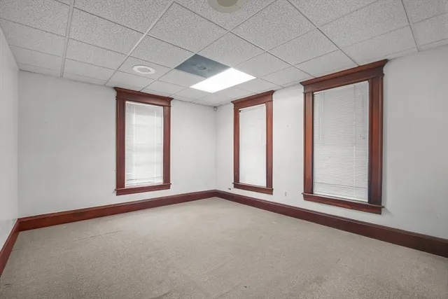 a kitchen with a refrigerator sink and cabinets