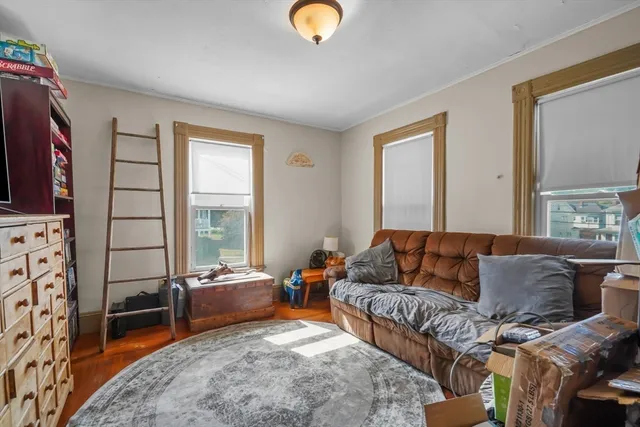 a bathroom with a toilet and a shower curtain