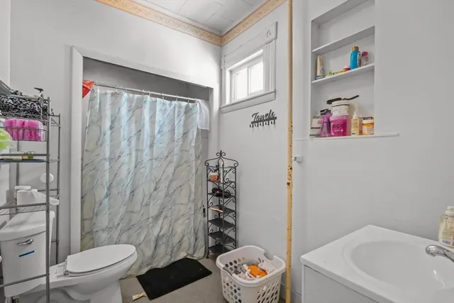 a bathroom with a toilet and a sink