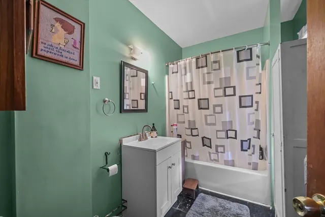 a bedroom with furniture and a chandelier