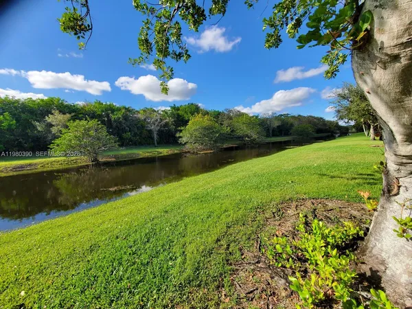 a view of a lake with a yard