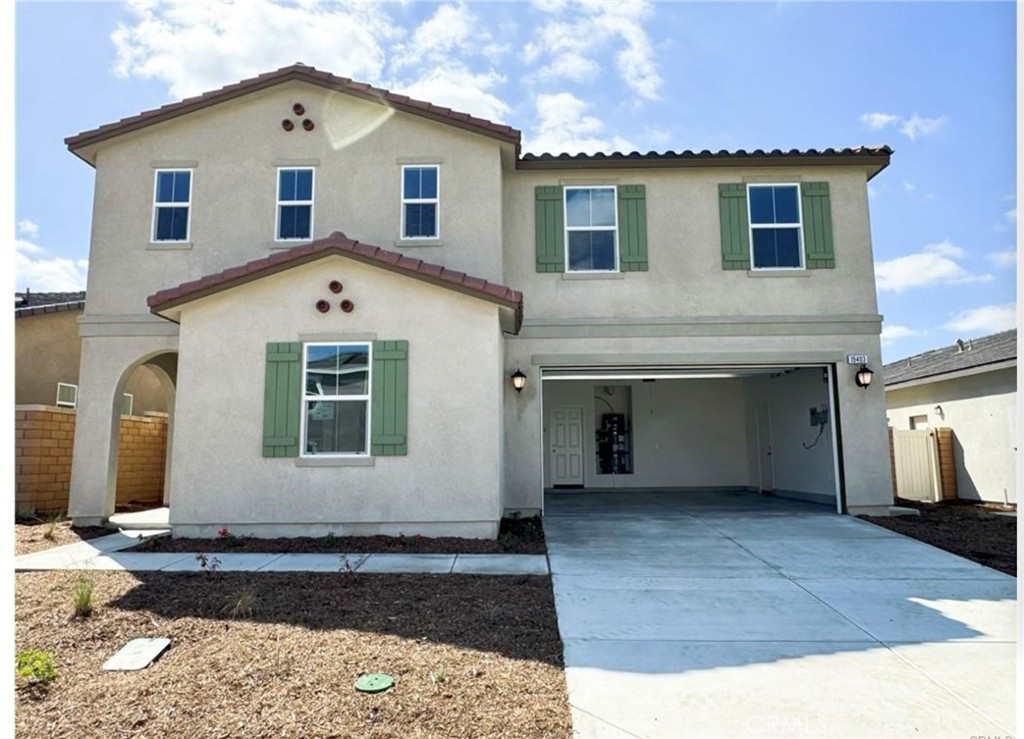 a front view of a house with a garage