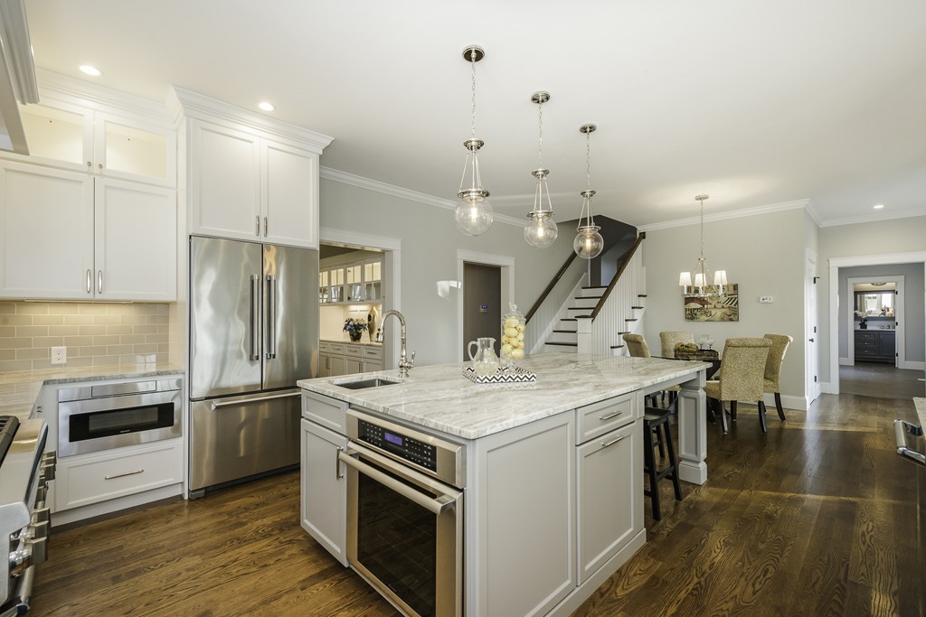 19 Hinds Road Winchester, MA 01890 - Photo 8 of 29 a kitchen with a stove a refrigerator and a fireplace