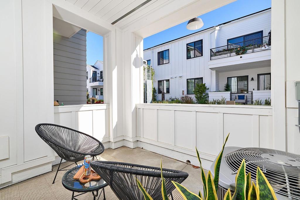 1601 San Remo Place, Unit 101 Encinitas, CA 92024 - Photo 11 of 27 a view of a room that has a table and chairs in it