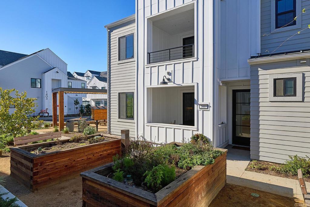 1601 San Remo Place, Unit 101 Encinitas, CA 92024 - Photo 18 of 27 a front view of a house with outdoor space