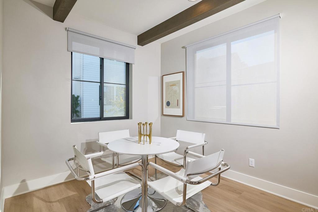 1601 San Remo Place, Unit 101 Encinitas, CA 92024 - Photo 9 of 27 a dining room with furniture and window