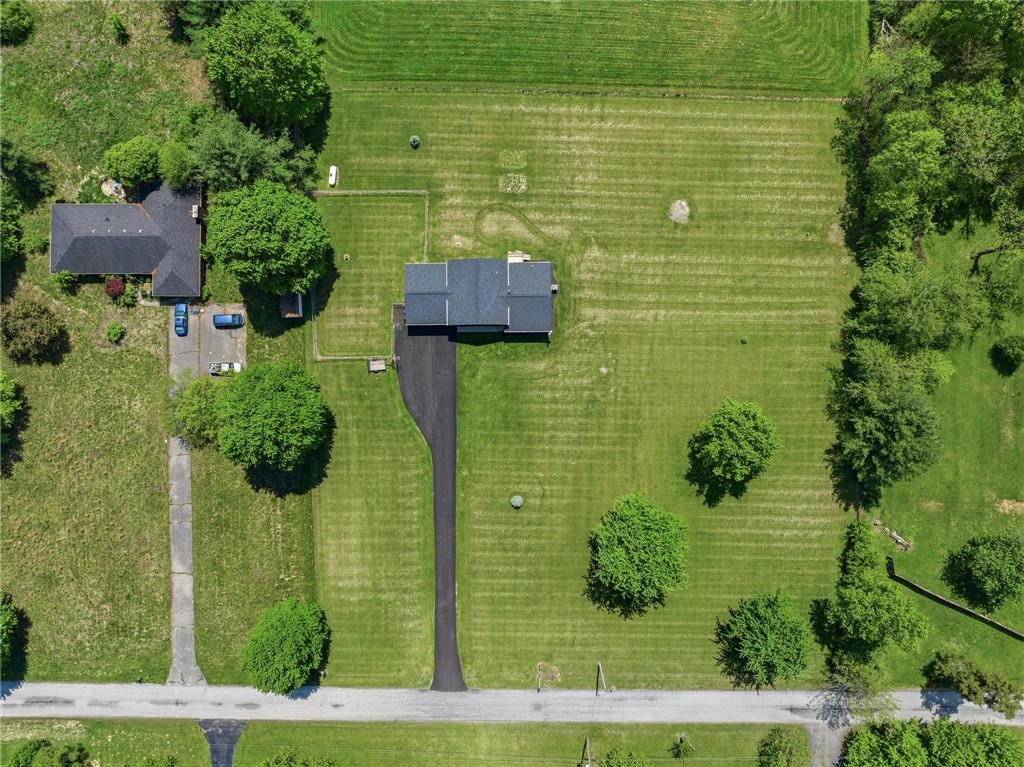 1353 Foust Road Xenia, OH 45385 - Photo 21 of 50 An aerial view captures the home nestled amidst verdant fields, offering serene rural living.