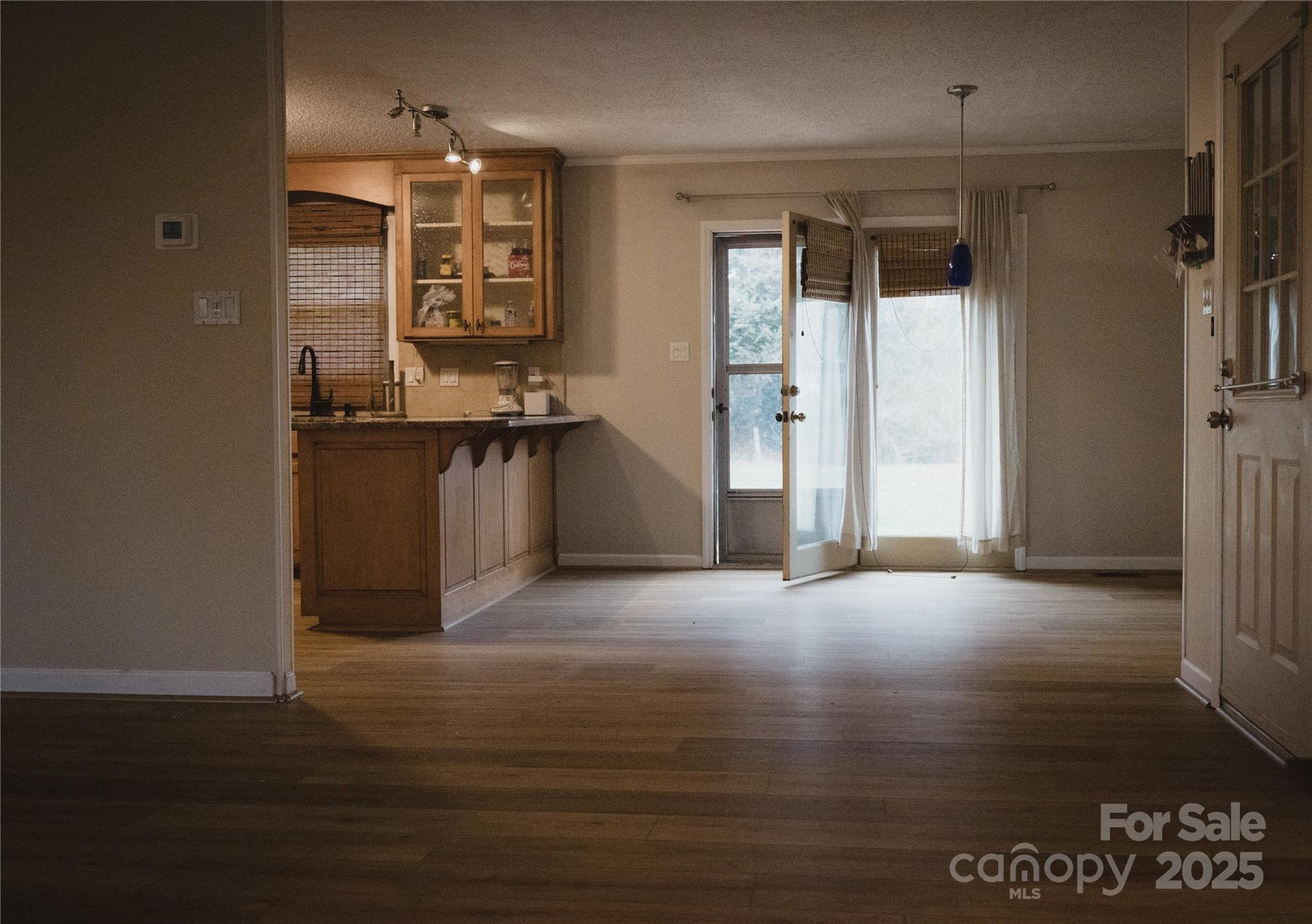 451 James Farm Road Statesville, NC 28625 - Photo 13 of 30 a view of an empty room with a kitchen