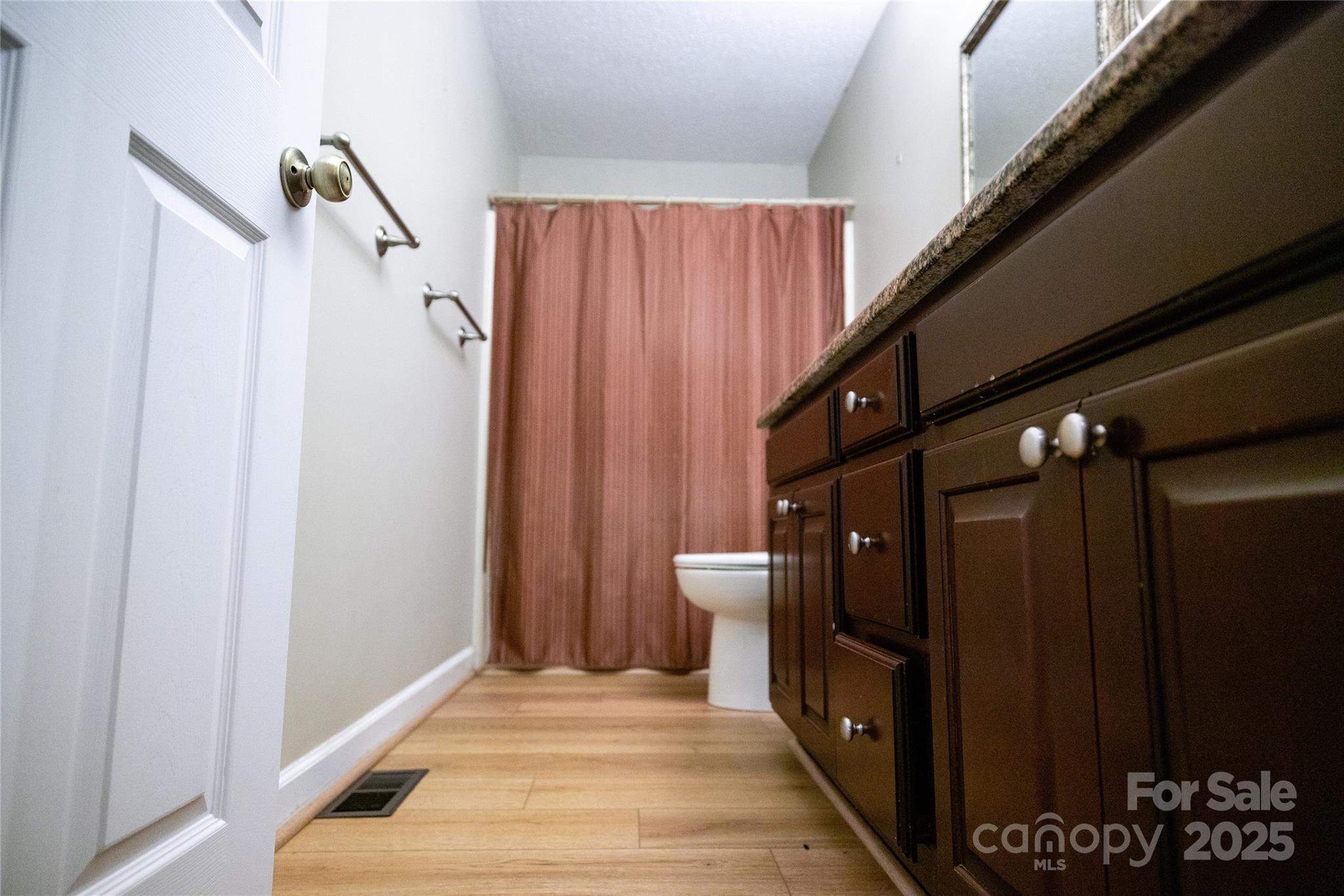 451 James Farm Road Statesville, NC 28625 - Photo 17 of 30 a view of a hallway with wooden floor and staircase