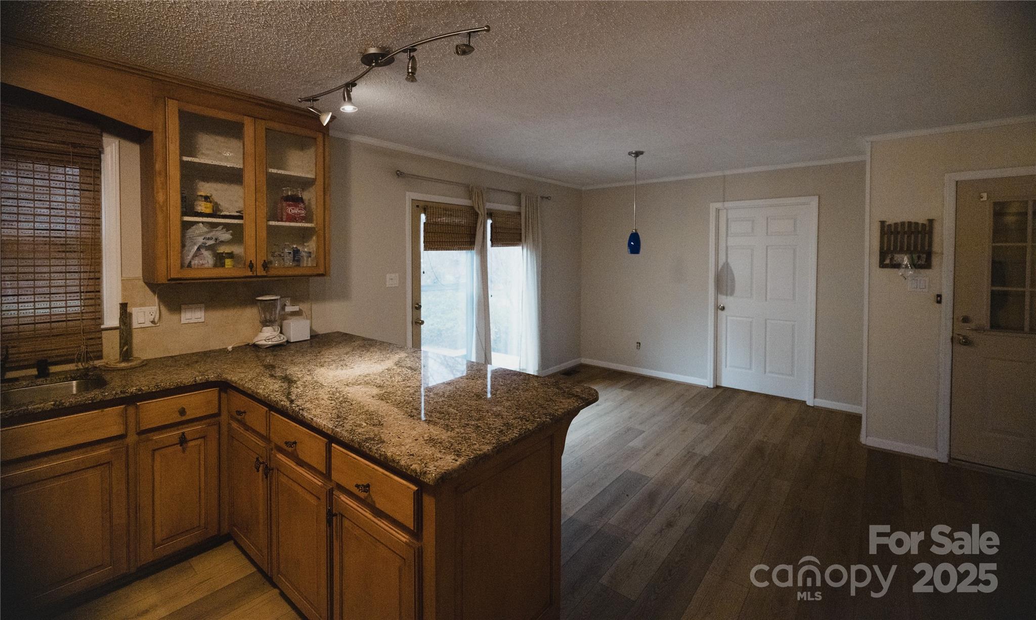 451 James Farm Road Statesville, NC 28625 - Photo 24 of 30 a kitchen with stainless steel appliances granite countertop a sink and cabinets