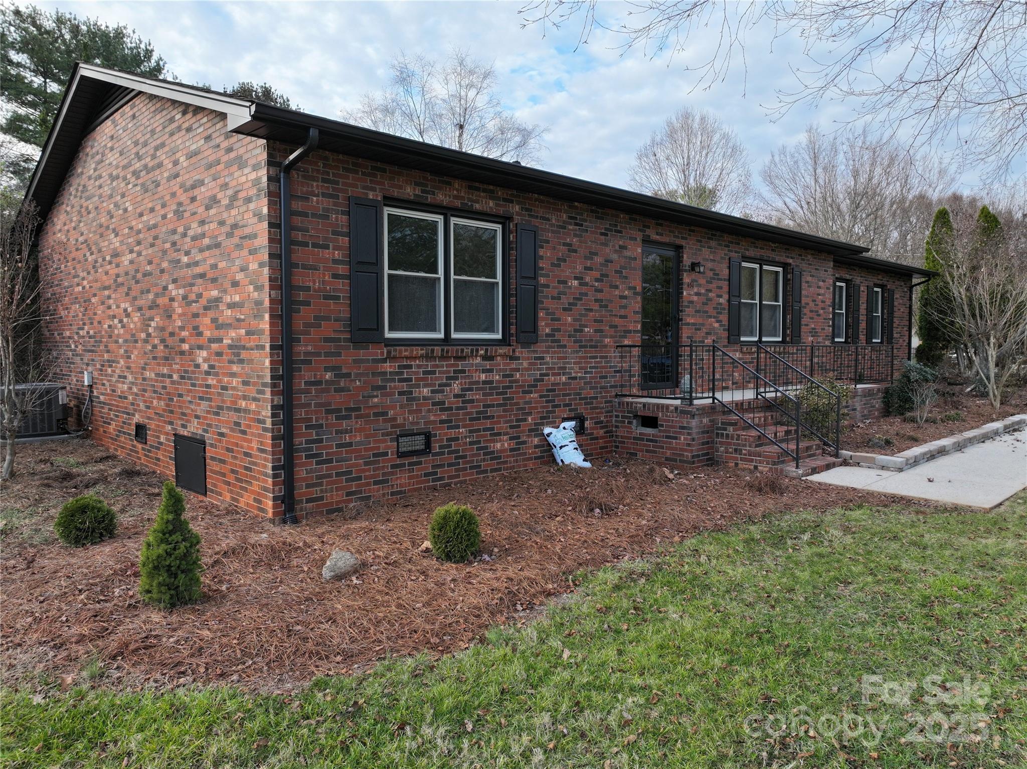 451 James Farm Road Statesville, NC 28625 - Photo 4 of 30 a front view of a house with garden