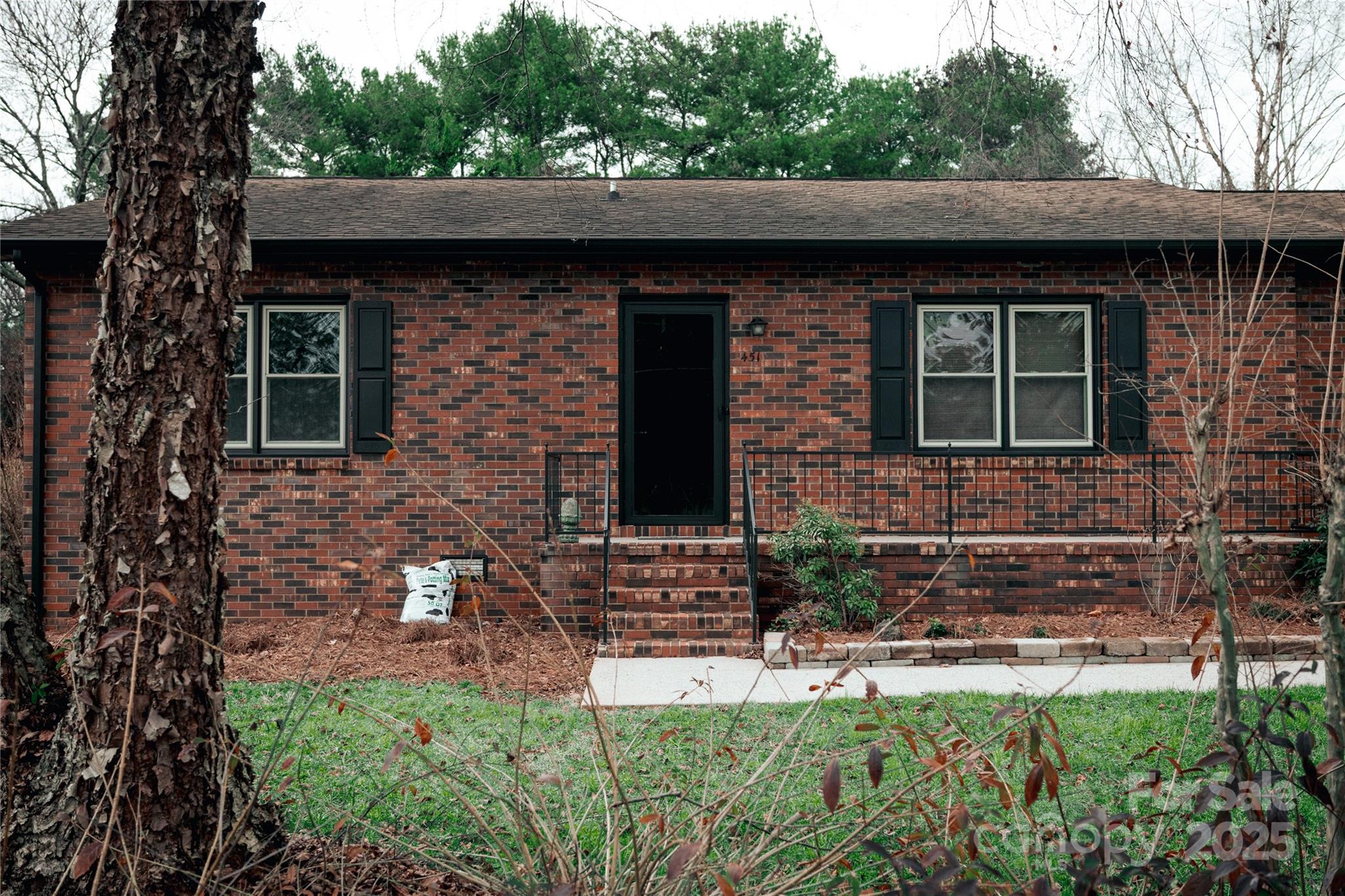 451 James Farm Road Statesville, NC 28625 - Photo 7 of 30 a front view of a house with garden