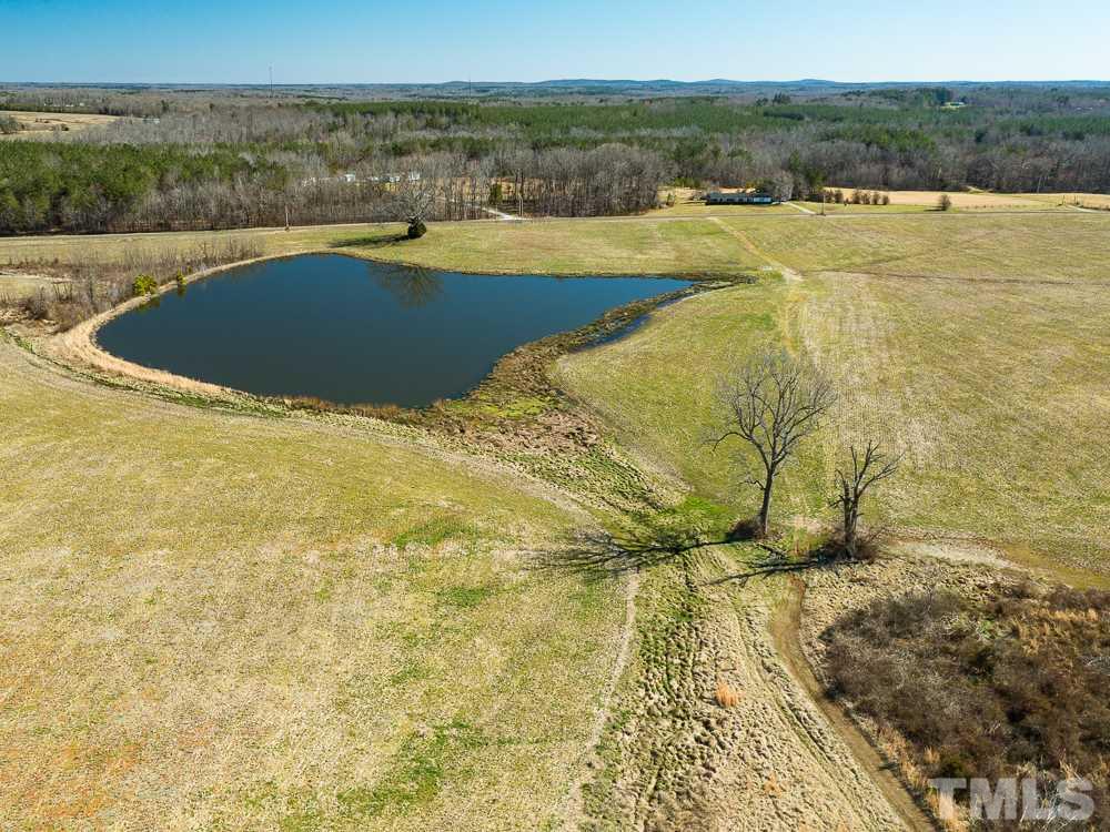 1 Thomas Store Road Timberlake, NC 27583 - Photo 23 of 28 a view of a lake with a yard