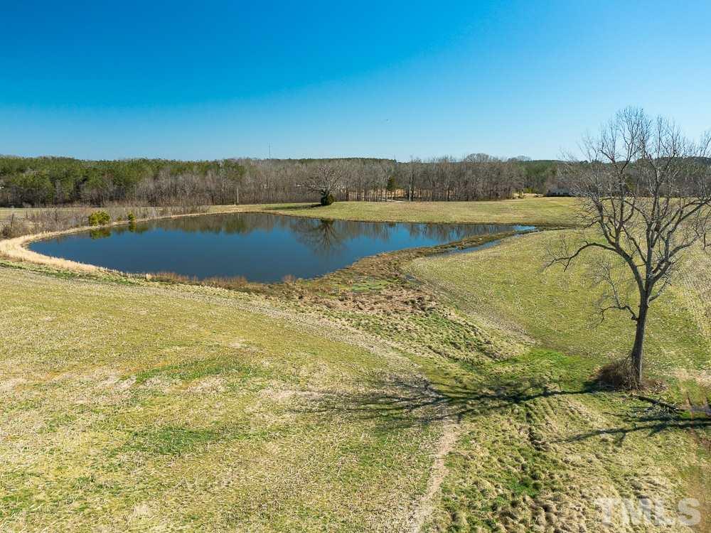 1 Thomas Store Road Timberlake, NC 27583 - Photo 24 of 28 a view of a lake with houses in the background