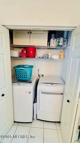 a utility room with washer and dryer