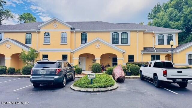 1414 Vista Cove Road St. Augustine, FL 32084 - Photo 2 of 29 a front view of a house with a garden