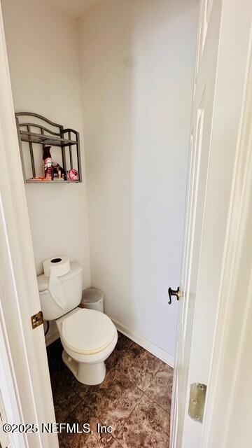 1414 Vista Cove Road St. Augustine, FL 32084 - Photo 27 of 29 a bathroom with a toilet and a shower