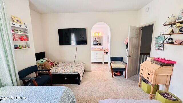 1414 Vista Cove Road St. Augustine, FL 32084 - Photo 29 of 29 a living room with furniture flowerpot and a flat screen tv