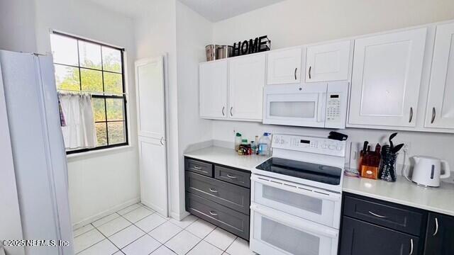 1414 Vista Cove Road St. Augustine, FL 32084 - Photo 7 of 29 a kitchen with stainless steel appliances white cabinets and a window