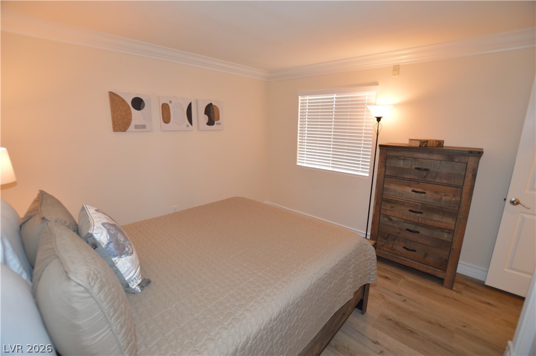 230 East Flamingo Road, Unit 334 Las Vegas, NV 89169 - Photo 15 of 37 Elegant crown molding complements the warm wood flooring in this inviting retreat.