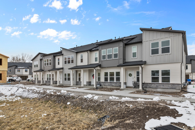 3014 South 265th Street West Logan, UT 84321 - Photo 1 of 25 Modern townhome row featuring multi-toned siding, dark roofs, and stone accents