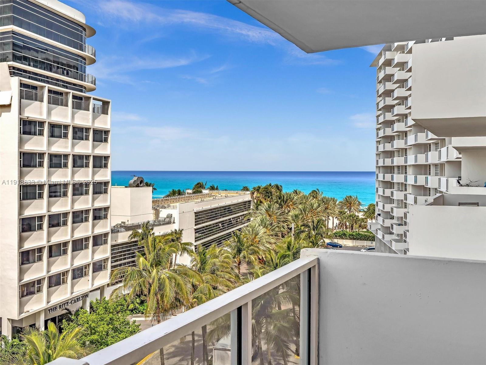 100 Lincoln Road, Unit 710 Miami Beach, FL 33139 - Photo 1 of 36 a view of a balcony with wooden floor and city view
