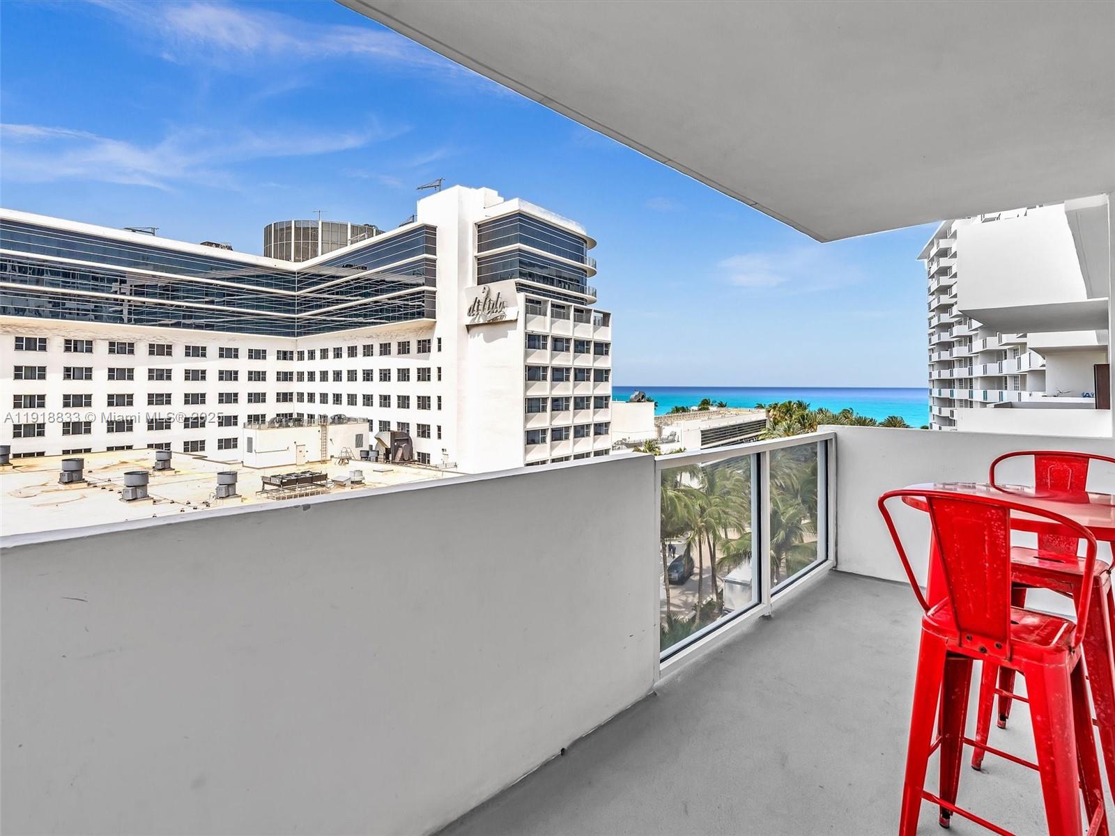 100 Lincoln Road, Unit 710 Miami Beach, FL 33139 - Photo 18 of 36 a view of a chairs and table in a balcony