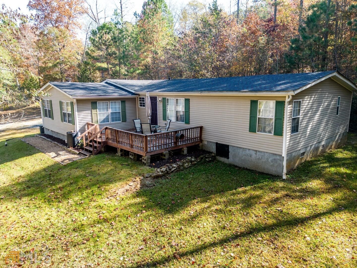 323 Thorpe Road Jackson, GA 30233 - Photo 1 of 1 a view of a house with a yard and deck