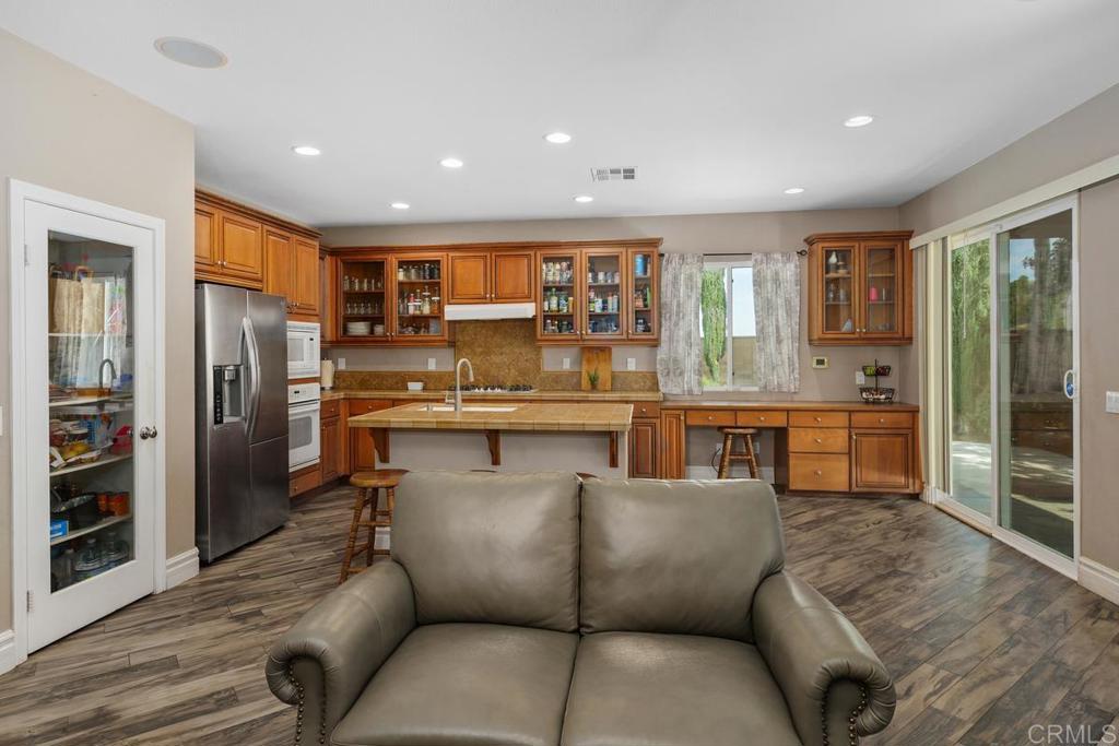 44684 Mumm Street Temecula, CA 92592 - Photo 14 of 51 a living room with stainless steel appliances furniture and a kitchen view
