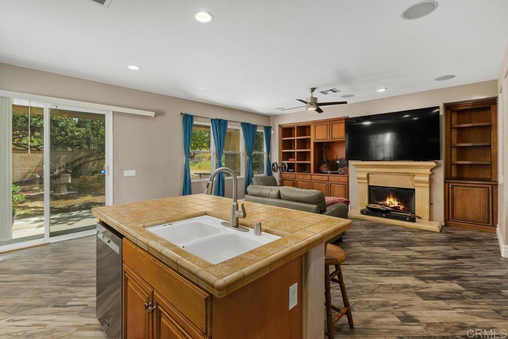 44684 Mumm Street Temecula, CA 92592 - Photo 19 of 51 a kitchen with a sink and a fireplace