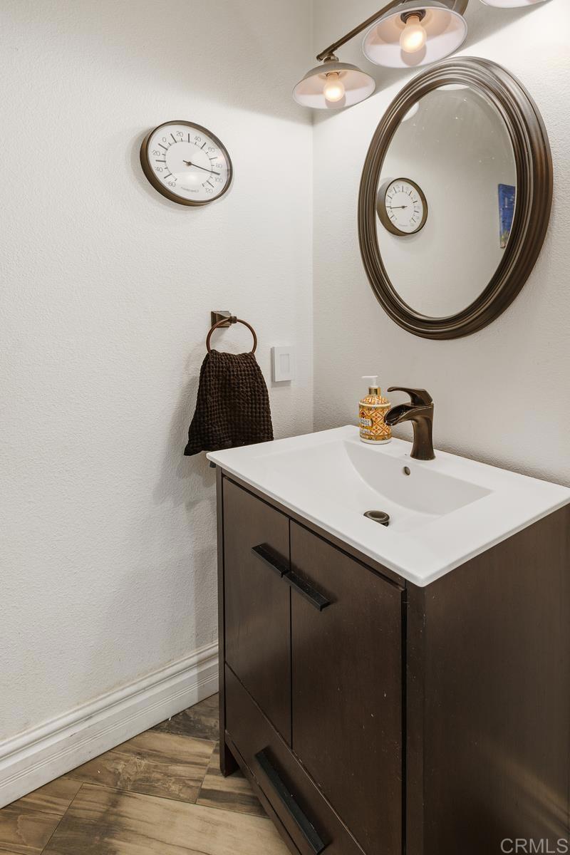 44684 Mumm Street Temecula, CA 92592 - Photo 20 of 51 a bathroom with a sink and a mirror